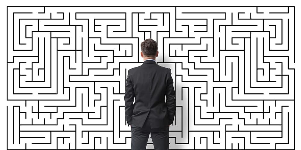 Businessman staring at a maze